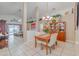 Bright dining room with wood table and hutch at 7532 Regents Garden Way, Apollo Beach, FL 33572