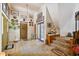 Entryway with tiled floor, stairs, and lots of wall art at 2512 Ayers Hill Ct, Lutz, FL 33559