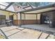 Outdoor patio with grill and access to the home and pool at 2512 Ayers Hill Ct, Lutz, FL 33559