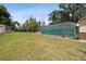 Spacious backyard with grassy area and pool at 2512 Ayers Hill Ct, Lutz, FL 33559