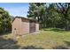 Well-maintained storage shed in a grassy backyard setting at 2512 Ayers Hill Ct, Lutz, FL 33559