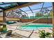 Inviting pool area with a hammock and screened enclosure at 2512 Ayers Hill Ct, Lutz, FL 33559