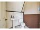 Small half bathroom with pedestal sink and toilet at 2512 Ayers Hill Ct, Lutz, FL 33559