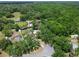 Aerial view of homes nestled in a lush, wooded neighborhood at 2512 Ayers Hill Ct, Lutz, FL 33559