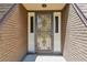 Front door with decorative wrought iron security door at 2512 Ayers Hill Ct, Lutz, FL 33559