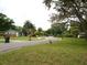Quiet residential street with mature trees and well-maintained lawns at 2512 Ayers Hill Ct, Lutz, FL 33559
