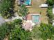 Bird's-eye view showcasing a home, pool, and surrounding trees at 2512 Ayers Hill Ct, Lutz, FL 33559