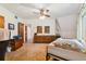 Bedroom with window, ceiling fan, and wood furniture at 2512 Ayers Hill Ct, Lutz, FL 33559