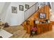 Wooden staircase with metal railing and built-in storage at 2512 Ayers Hill Ct, Lutz, FL 33559