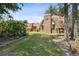 Brick home with unique architectural features and lush lawn at 2512 Ayers Hill Ct, Lutz, FL 33559