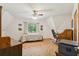 Bright bedroom with a window, built-in desk and a ceiling fan at 2512 Ayers Hill Ct, Lutz, FL 33559