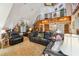 Open concept living area with high ceilings, fireplace, and a lofted area at 2512 Ayers Hill Ct, Lutz, FL 33559