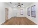 Spacious bedroom with hardwood floors and ceiling fan at 1514 E 26Th Ave, Tampa, FL 33605