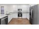 Modern kitchen with white cabinets, granite counters, and stainless steel appliances at 1514 E 26Th Ave, Tampa, FL 33605