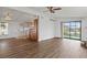Open living room and kitchen with wood-look floors at 3931 Chris Dr, Wesley Chapel, FL 33543