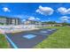Community pool with accessible parking and surrounding buildings at 3931 Chris Dr, Wesley Chapel, FL 33543