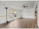 Spacious living room with wood-look floors and ceiling fan at 3931 Chris Dr, Wesley Chapel, FL 33543