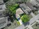 Aerial view of house for sale near a lake at 12215 Woodlands Cir, Dade City, FL 33525