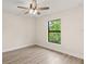 Spacious bedroom featuring a large window and ceiling fan at 156 Haddock Dr, Rotonda West, FL 33947