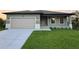 Charming one-story home with attached garage at 156 Haddock Dr, Rotonda West, FL 33947
