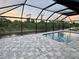 Relaxing screened pool and patio area with pavers at 156 Haddock Dr, Rotonda West, FL 33947