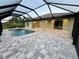 Relaxing pool and patio area with covered lanai at 156 Haddock Dr, Rotonda West, FL 33947