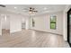 Spacious bedroom with wood-look flooring and access to a private bathroom at 156 Haddock Dr, Rotonda West, FL 33947