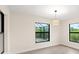 Bright dining room with wood-look floors and large windows at 156 Haddock Dr, Rotonda West, FL 33947