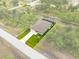 Aerial view showing home's location on a lot with canal access at 156 Haddock Dr, Rotonda West, FL 33947