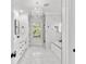 Luxurious bathroom with marble finishes, a soaking tub, and a walk-in shower at 5002 W Homer Ave, Tampa, FL 33629