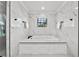 Bright, spacious bathroom boasts a soaking tub with a large window at 5002 W Homer Ave, Tampa, FL 33629
