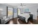 Cozy bedroom featuring a large window and neutral decor, with a comfy chair for reading or relaxing at 5002 W Homer Ave, Tampa, FL 33629