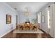 Bright dining room with hardwood floors and large table at 5002 W Homer Ave, Tampa, FL 33629