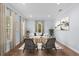 Elegant living room featuring wood floors, neutral walls, a decorative rug and comfortable seating at 5002 W Homer Ave, Tampa, FL 33629