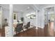 Elegant living room featuring wood floors, neutral walls, a decorative rug and comfortable seating at 5002 W Homer Ave, Tampa, FL 33629