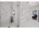 Spa-like bathroom with marble finishes, a walk-in shower, and a soaking tub at 5002 W Homer Ave, Tampa, FL 33629