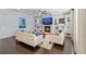 Relaxing living room with hardwood floors, fireplace, and built-in shelves at 5002 W Homer Ave, Tampa, FL 33629