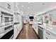 Open concept kitchen with breakfast bar and views into the living room at 5002 W Homer Ave, Tampa, FL 33629