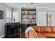 Stylish home bar with mosaic backsplash and ample storage at 5002 W Homer Ave, Tampa, FL 33629