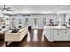 Open concept kitchen with white cabinets and large island at 5002 W Homer Ave, Tampa, FL 33629