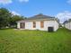 Large backyard offering plenty of space for recreation at 11440 Misty Isle Ln, Riverview, FL 33579
