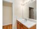 Simple bathroom with a single sink and access to another room at 11440 Misty Isle Ln, Riverview, FL 33579