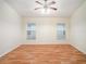 Spacious bedroom with laminate wood flooring and ceiling fan at 11440 Misty Isle Ln, Riverview, FL 33579