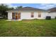 Spacious backyard with patio and grassy area at 11440 Misty Isle Ln, Riverview, FL 33579