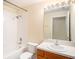 Clean bathroom with a shower/tub combo and updated vanity at 11440 Misty Isle Ln, Riverview, FL 33579