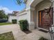 House exterior showcasing front door and landscaping at 11440 Misty Isle Ln, Riverview, FL 33579