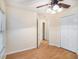 Well-lit bedroom featuring wood flooring and ample closet space at 11440 Misty Isle Ln, Riverview, FL 33579