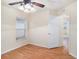 Bright bedroom with wood-look floors and ceiling fan at 11440 Misty Isle Ln, Riverview, FL 33579