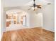 Open living room with kitchen views and ceiling fan at 11440 Misty Isle Ln, Riverview, FL 33579