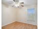 Bedroom featuring laminate wood flooring and a ceiling fan at 11440 Misty Isle Ln, Riverview, FL 33579
